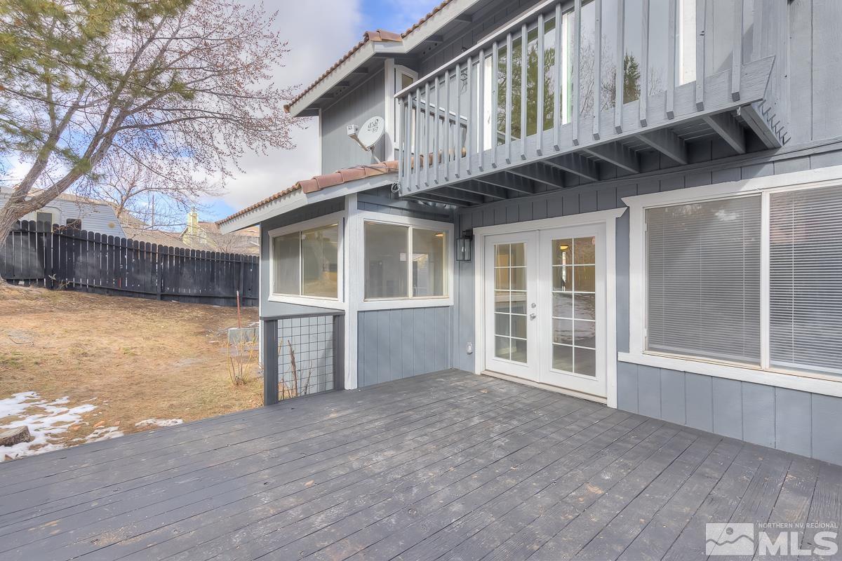 7196 Indigo Circle Reno, NV 89506 - Photo 27 of 33 a view of a house with a wooden deck