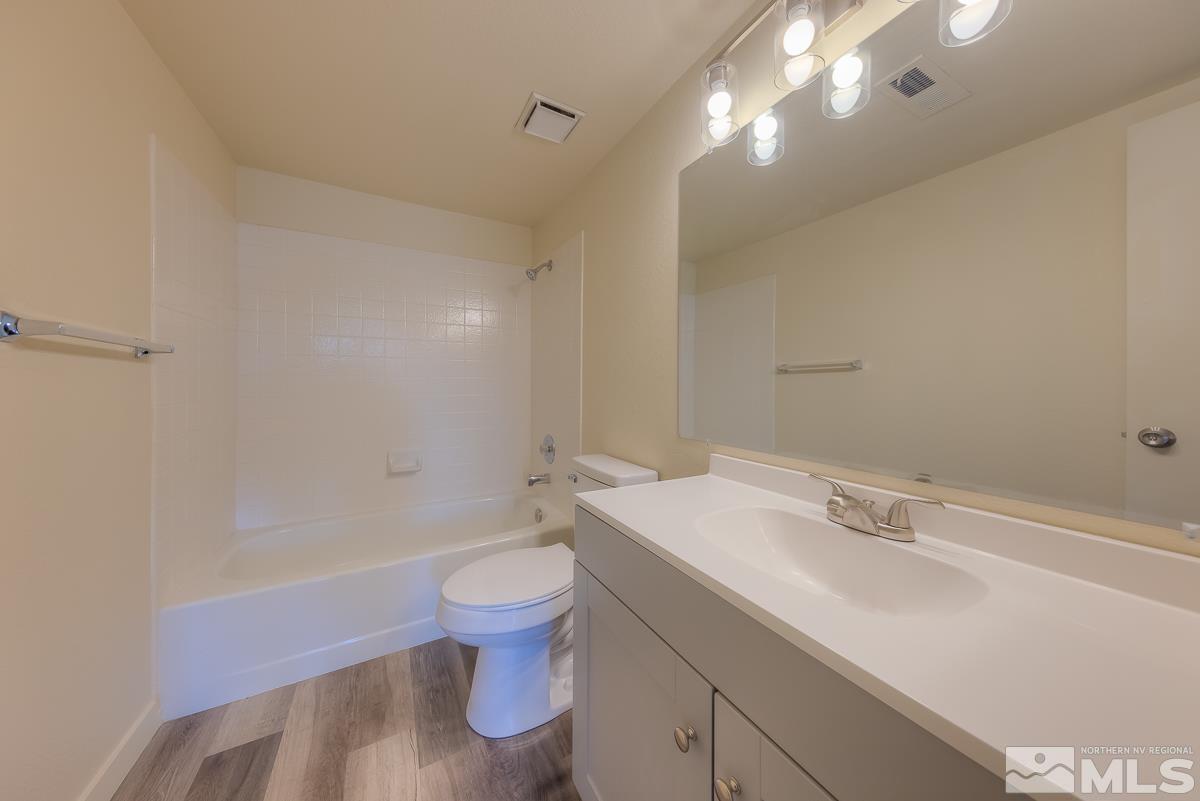 7196 Indigo Circle Reno, NV 89506 - Photo 28 of 33 a bathroom with a sink a toilet and shower