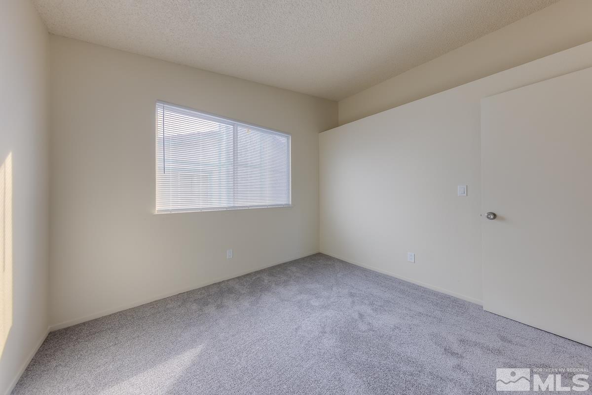 7196 Indigo Circle Reno, NV 89506 - Photo 8 of 33 an empty room with a window