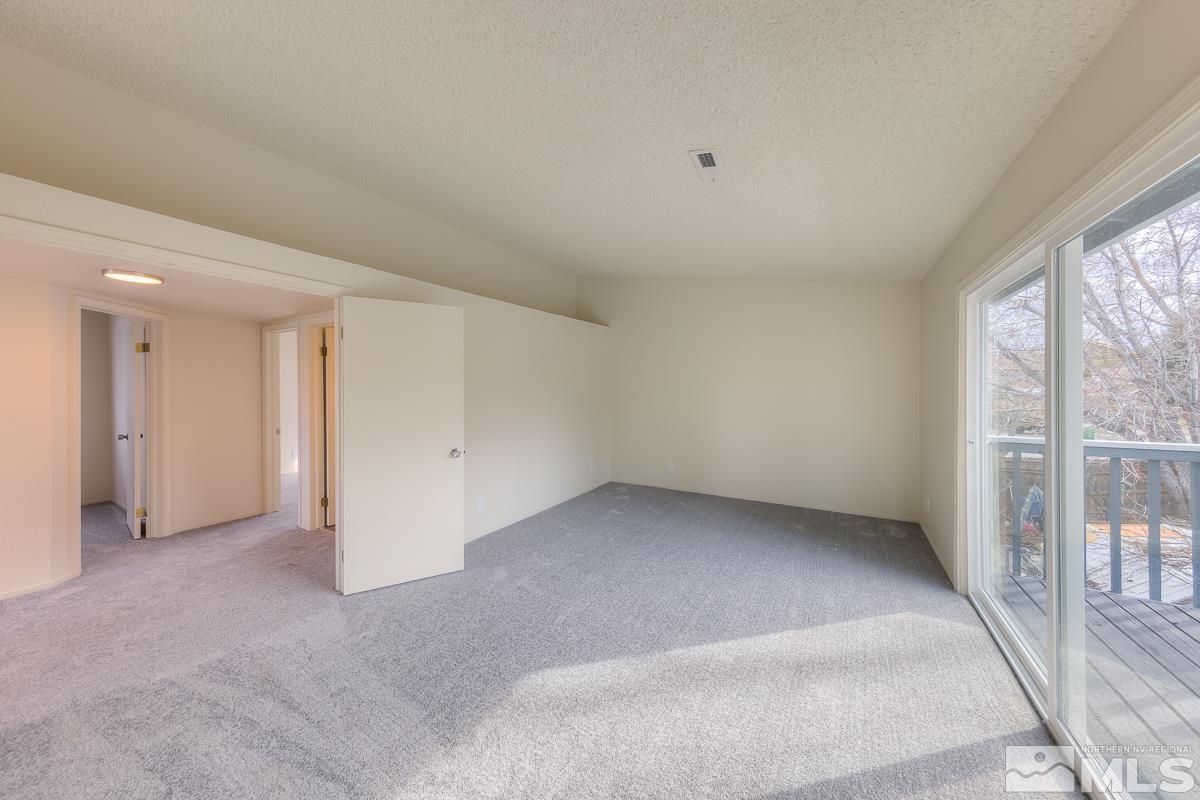 7196 Indigo Circle Reno, NV 89506 - Photo 10 of 33 a view of an empty room with a window