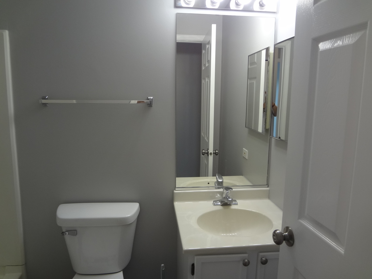 1127 North Red Oak Circle, Unit 4 Round Lake Beach, IL 60073 - Photo 11 of 31 a bathroom with a sink and a toilet