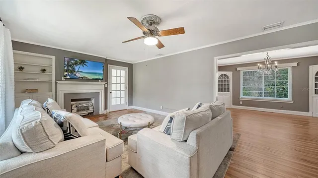 a living room with furniture and a fireplace