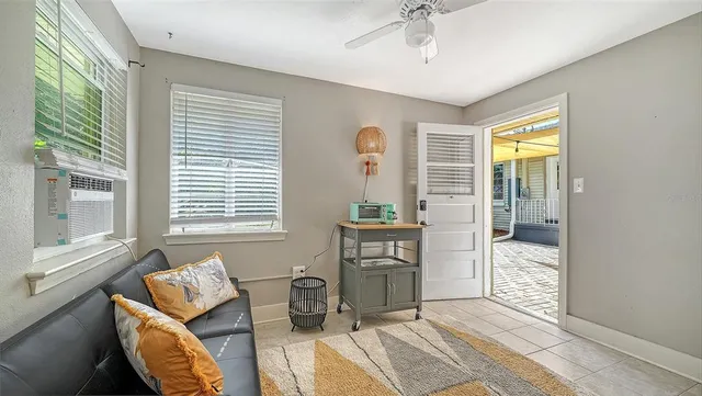 a living room with furniture and a window