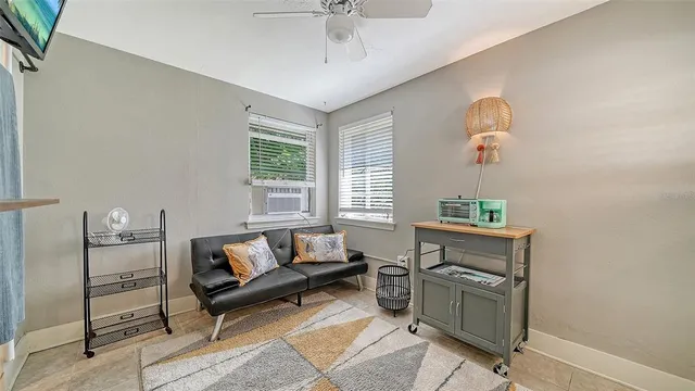 a living room with furniture and a window