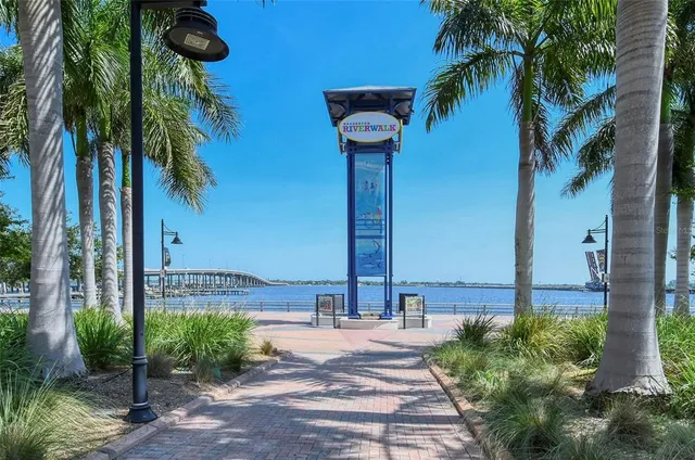 a front view of a house with palm tree