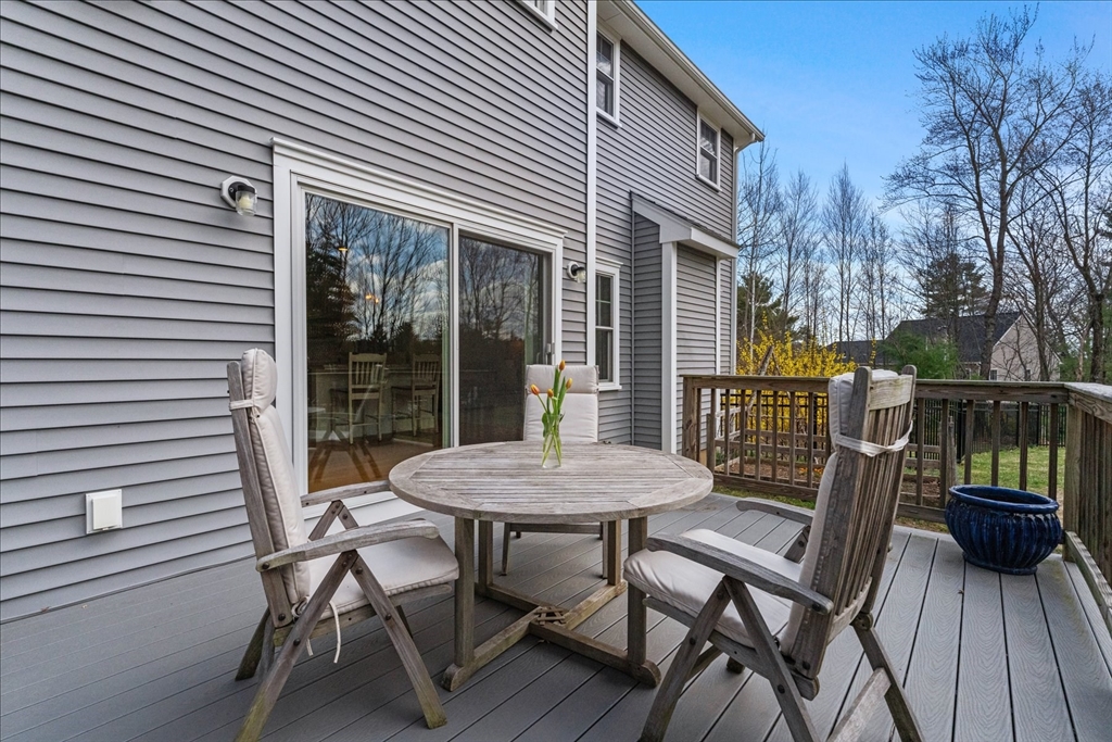 50 Quabbin Path Sutton, MA 01590 - Photo 35 of 42 a view of a patio with a table and chairs