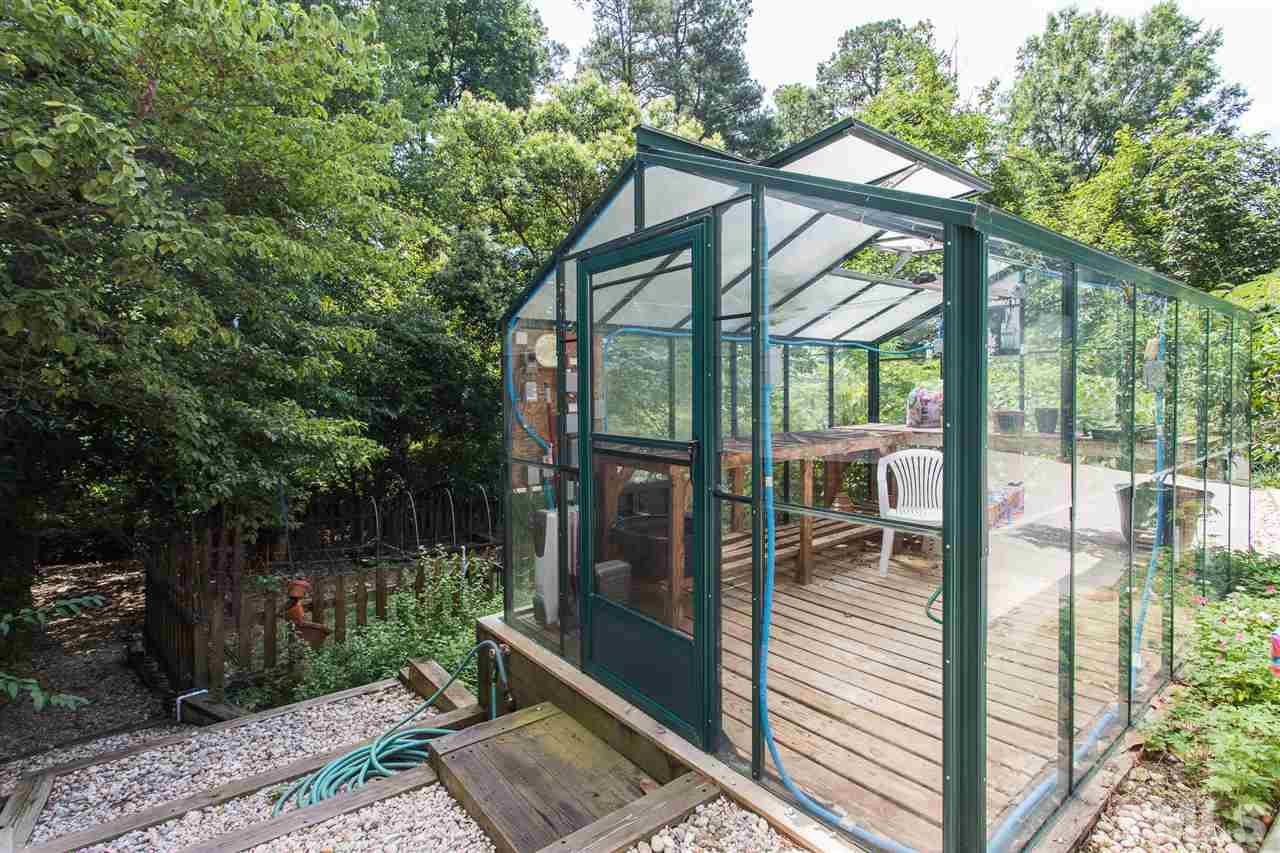 1430 Ridge Road Raleigh, NC 27607 - Photo 5 of 30 a view of a house with backyard from a garden