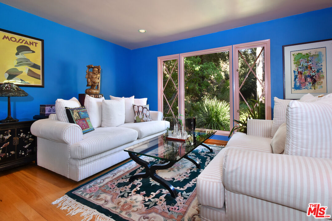 3833 Woodcliff Road Sherman Oaks, CA 91403 - Photo 11 of 52 a living room with furniture and a large window
