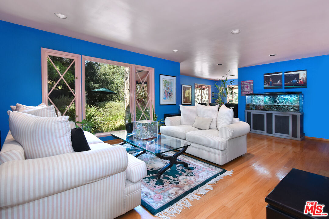 3833 Woodcliff Road Sherman Oaks, CA 91403 - Photo 12 of 52 a living room with furniture and a flat screen tv