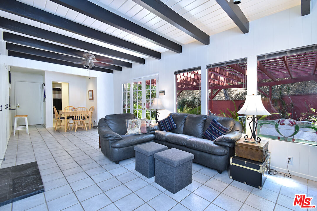 3833 Woodcliff Road Sherman Oaks, CA 91403 - Photo 20 of 52 a living room with furniture and a large window