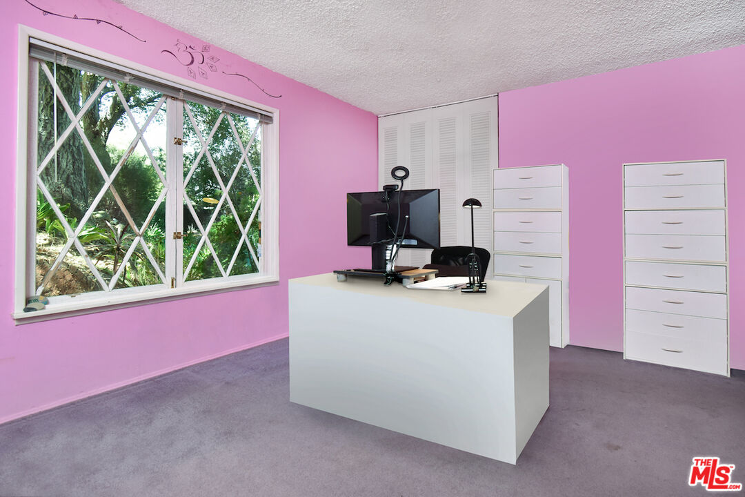3833 Woodcliff Road Sherman Oaks, CA 91403 - Photo 31 of 52 a view of a workspace with furniture and a window