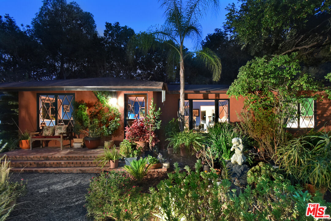 3833 Woodcliff Road Sherman Oaks, CA 91403 - Photo 45 of 52 a view of a house with sitting area and garden