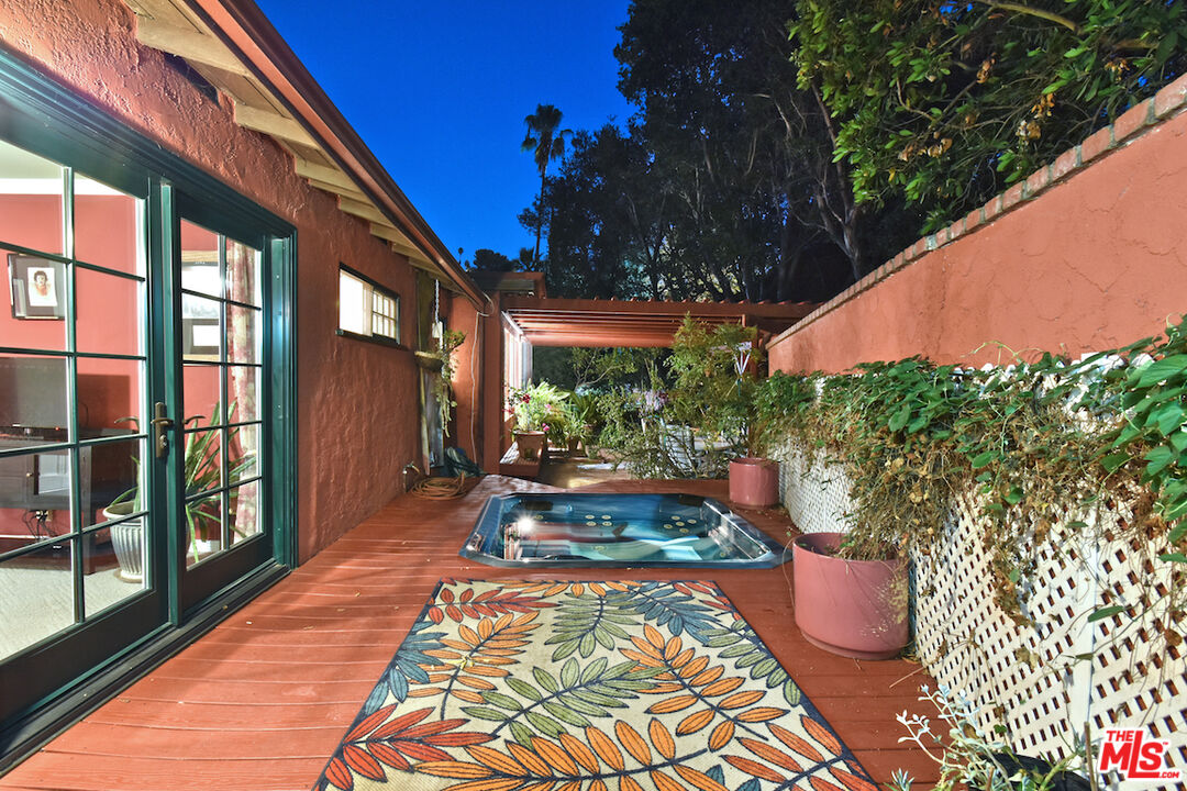 3833 Woodcliff Road Sherman Oaks, CA 91403 - Photo 49 of 52 a view of a backyard with sitting area