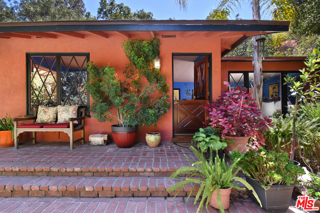 3833 Woodcliff Road Sherman Oaks, CA 91403 - Photo 5 of 52 a view of a porch with furniture