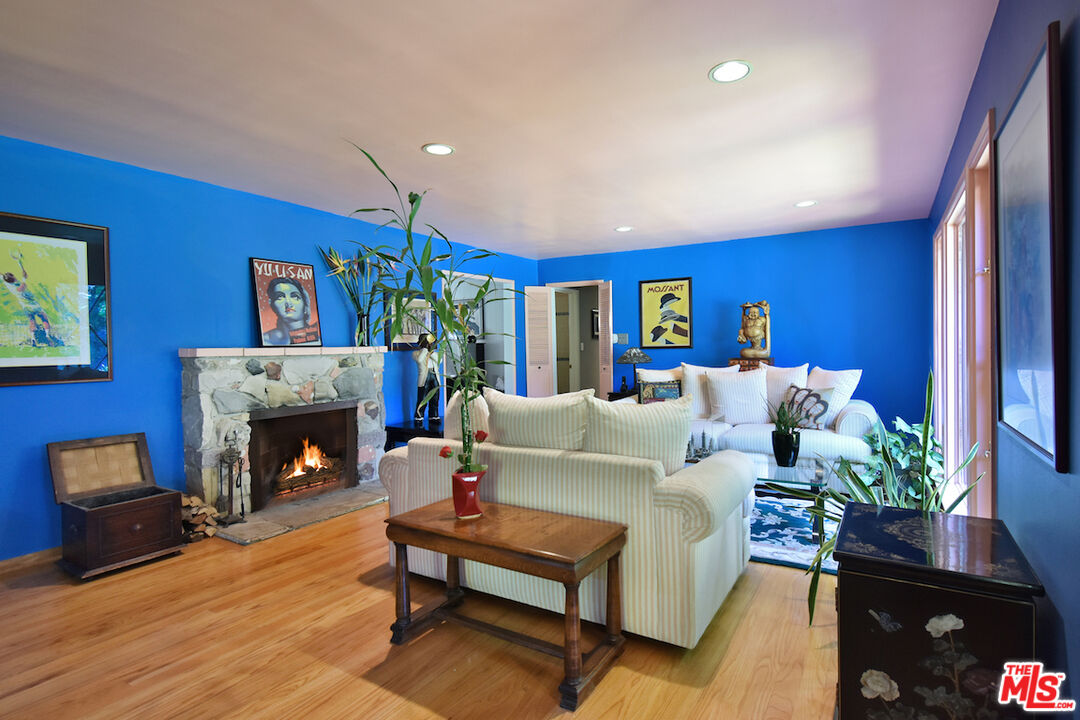 3833 Woodcliff Road Sherman Oaks, CA 91403 - Photo 10 of 52 a living room with furniture fireplace and a fireplace