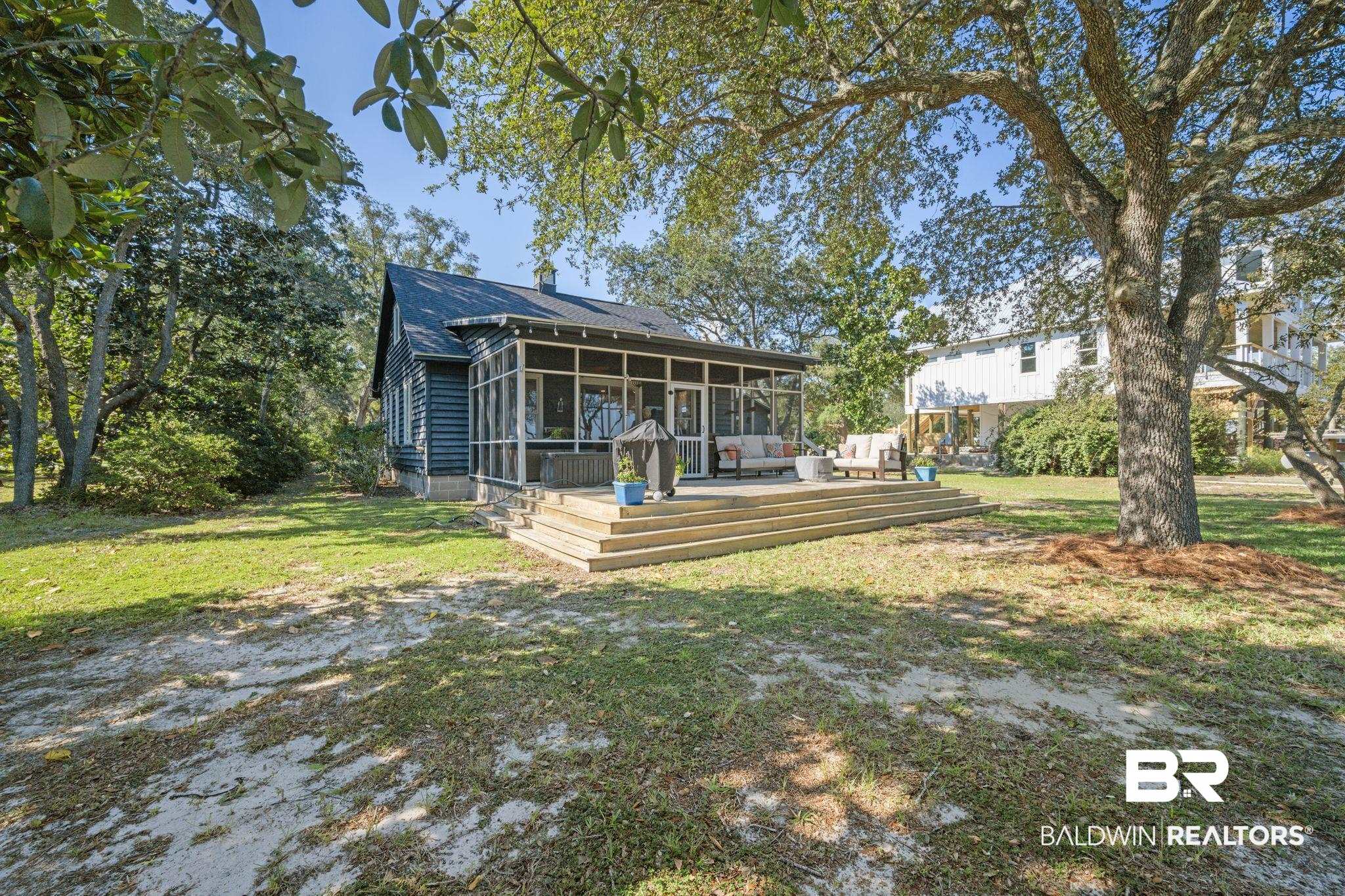 7646 Spring Branch Road Elberta, AL 36530 - Photo 36 of 85 Back of property featuring a deck, a sunroom, and a yard