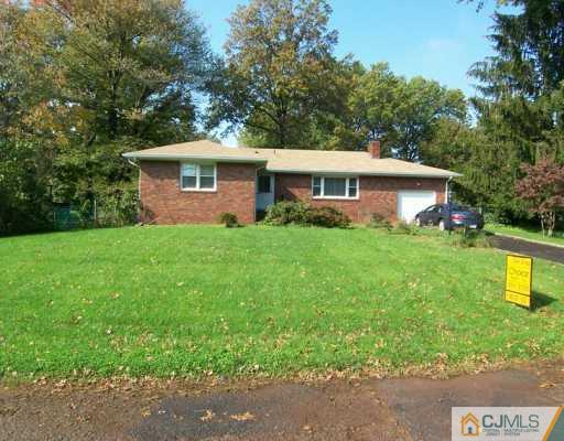 13 Ramsey Road Edison, NJ 08820 - Photo 1 of 8 a front view of a house with garden