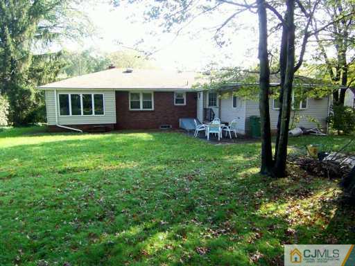 13 Ramsey Road Edison, NJ 08820 - Photo 6 of 8 a view of a house with a yard and sitting area