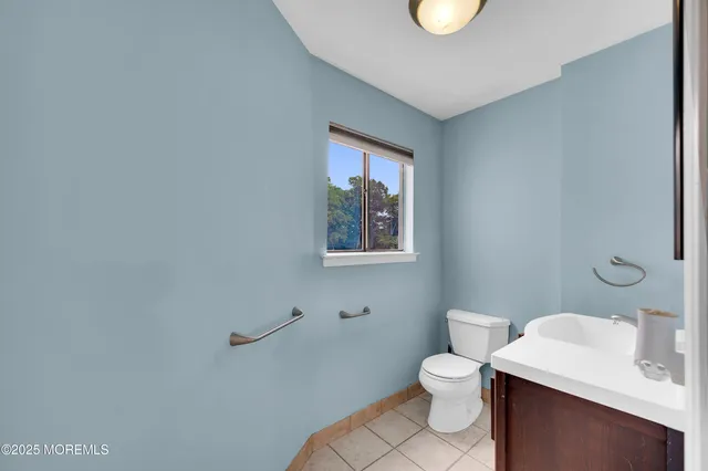 a kitchen with a refrigerator and a stove