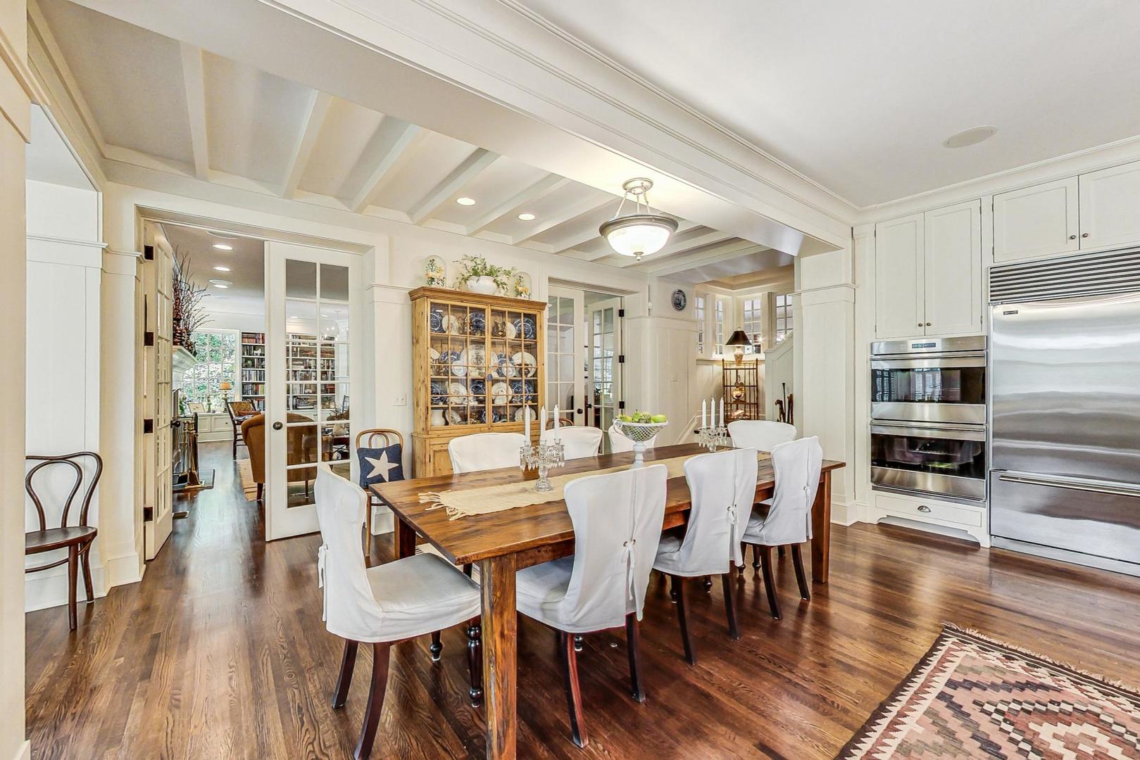 3510 Spring Road Oak Brook, IL 60523 - Photo 8 of 31 a view of a dining room with furniture and wooden floor