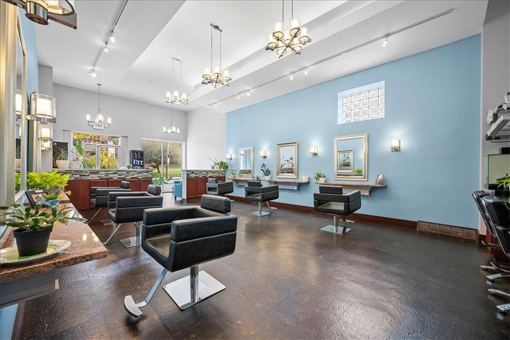 4731 Butler Street Pittsburgh, PA 15201 - Photo 11 of 50 a living room with furniture a chandelier and a flat screen tv