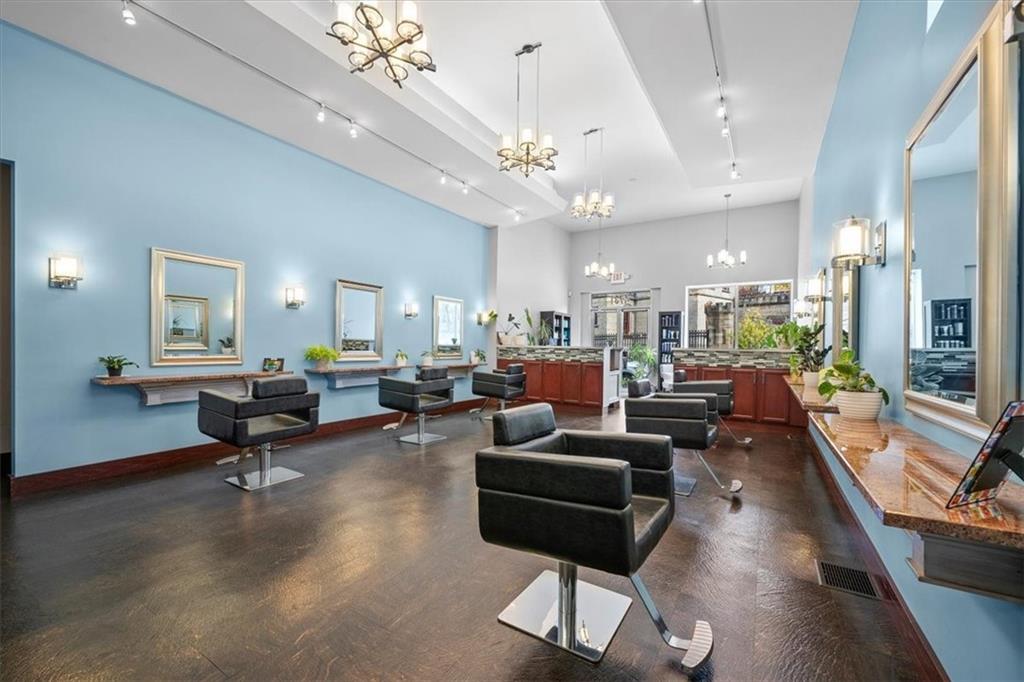 4731 Butler Street Pittsburgh, PA 15201 - Photo 12 of 50 a living room with furniture piano and a chandelier
