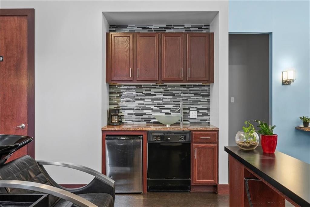 4731 Butler Street Pittsburgh, PA 15201 - Photo 14 of 50 a kitchen with a stove and a refrigerator