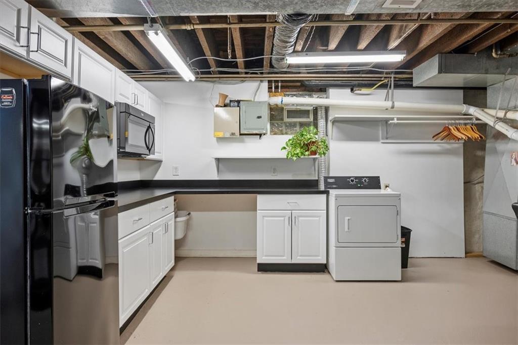 4731 Butler Street Pittsburgh, PA 15201 - Photo 19 of 50 a kitchen with cabinets and stainless steel appliances