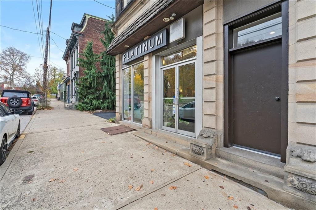 4731 Butler Street Pittsburgh, PA 15201 - Photo 2 of 50 a view of a brick house with a large windows