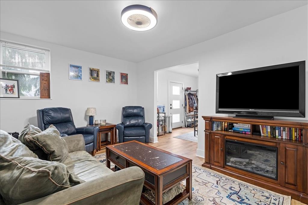4731 Butler Street Pittsburgh, PA 15201 - Photo 25 of 50 a living room with furniture and a flat screen tv