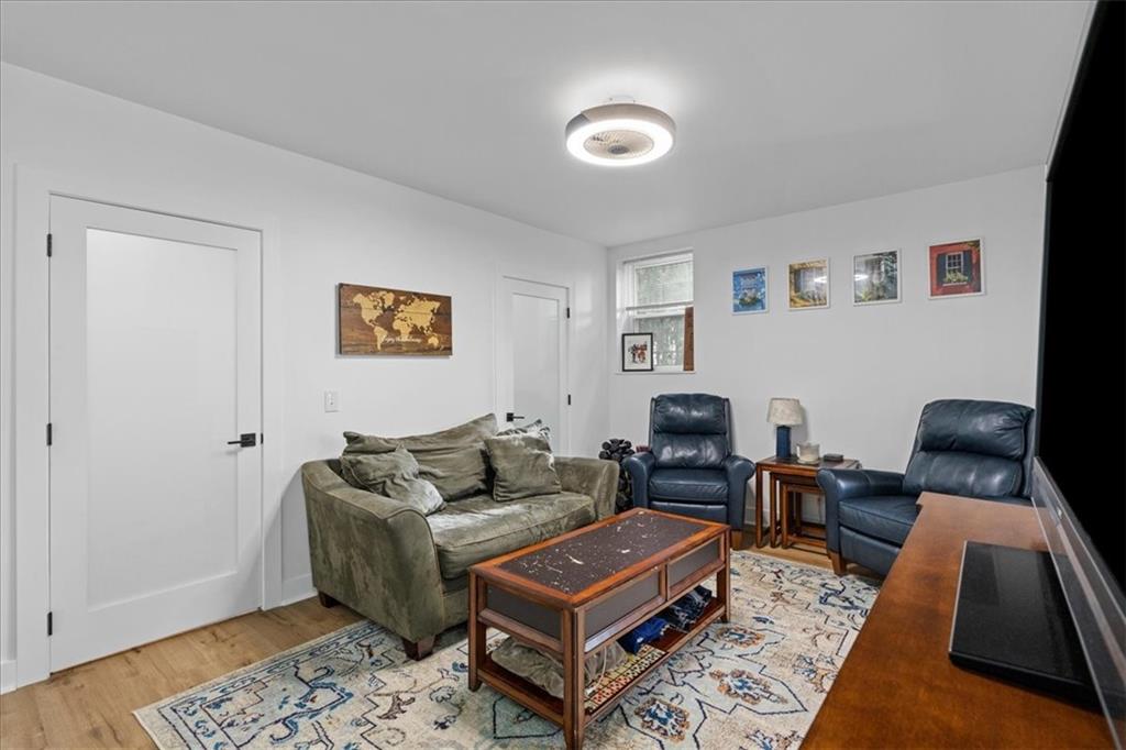 4731 Butler Street Pittsburgh, PA 15201 - Photo 26 of 50 a living room with furniture a rug and a window