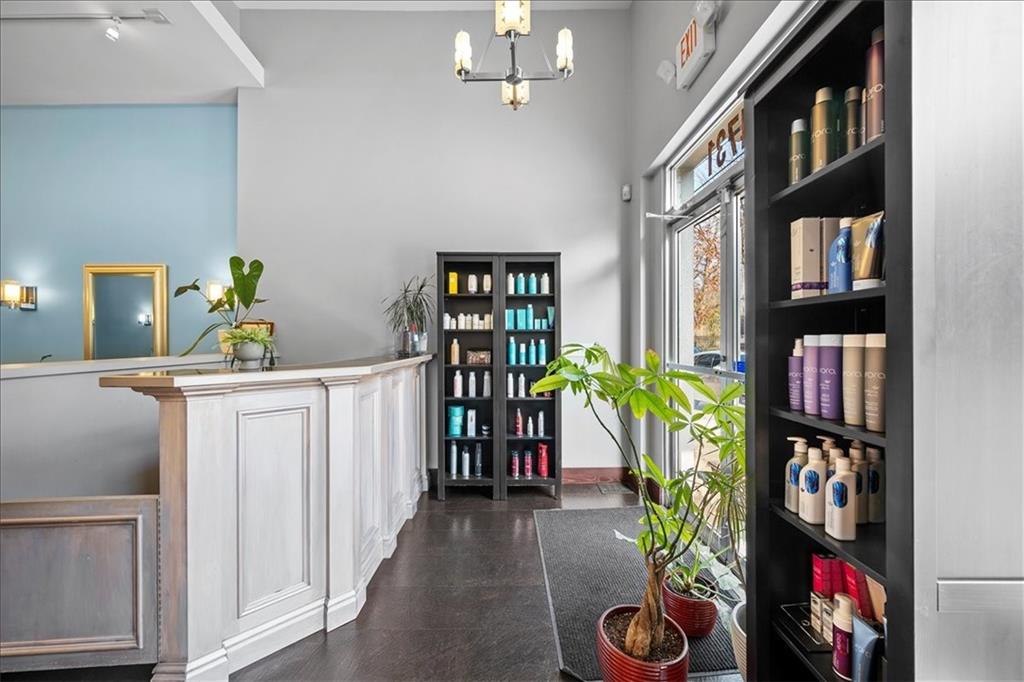 4731 Butler Street Pittsburgh, PA 15201 - Photo 3 of 50 a living room with lots of furniture a baby crib and a book shelf
