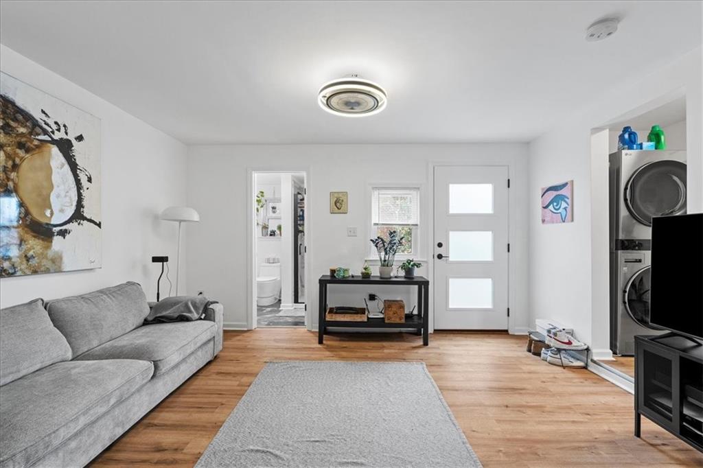 4731 Butler Street Pittsburgh, PA 15201 - Photo 31 of 50 a living room with furniture and a flat screen tv