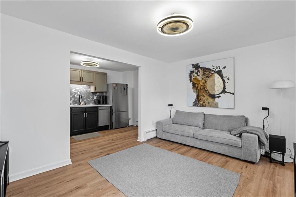 4731 Butler Street Pittsburgh, PA 15201 - Photo 32 of 50 a living room with furniture and wooden floor