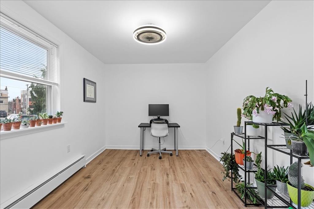 4731 Butler Street Pittsburgh, PA 15201 - Photo 35 of 50 a workspace with furniture and wooden floor