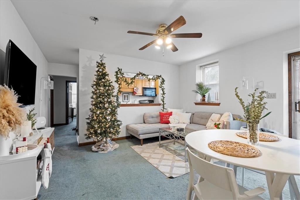 4731 Butler Street Pittsburgh, PA 15201 - Photo 38 of 50 a living room with furniture and a flat screen tv