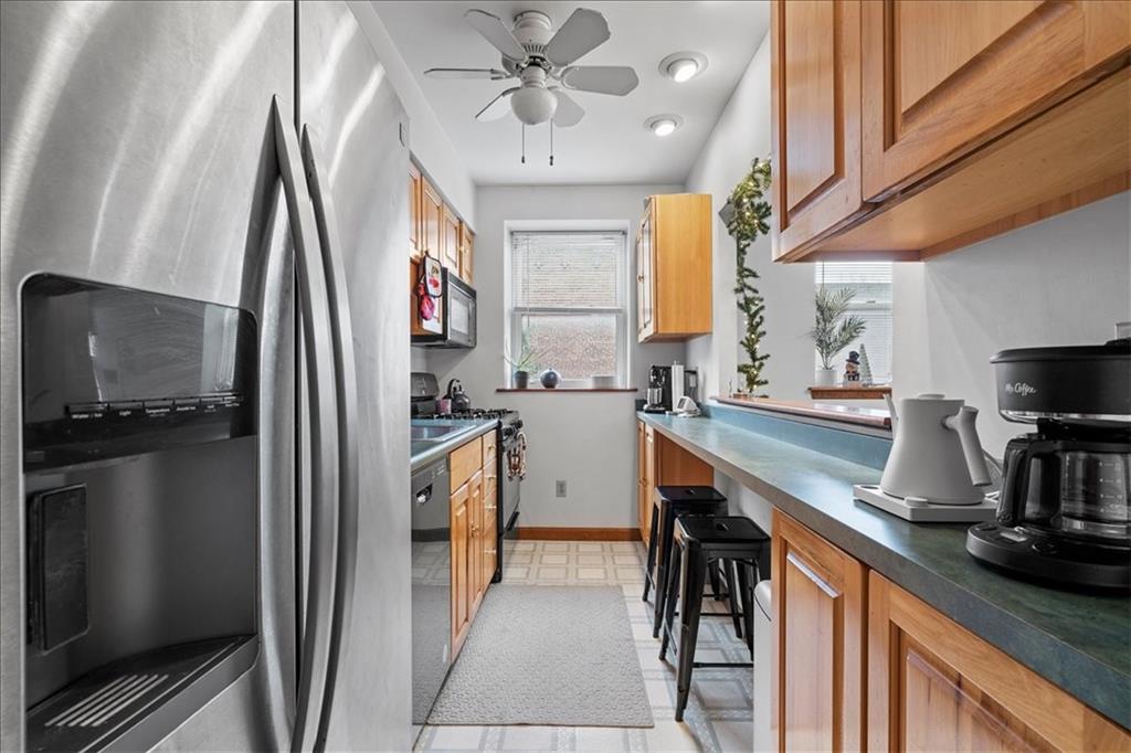 4731 Butler Street Pittsburgh, PA 15201 - Photo 39 of 50 a kitchen with refrigerator cabinets and a sink