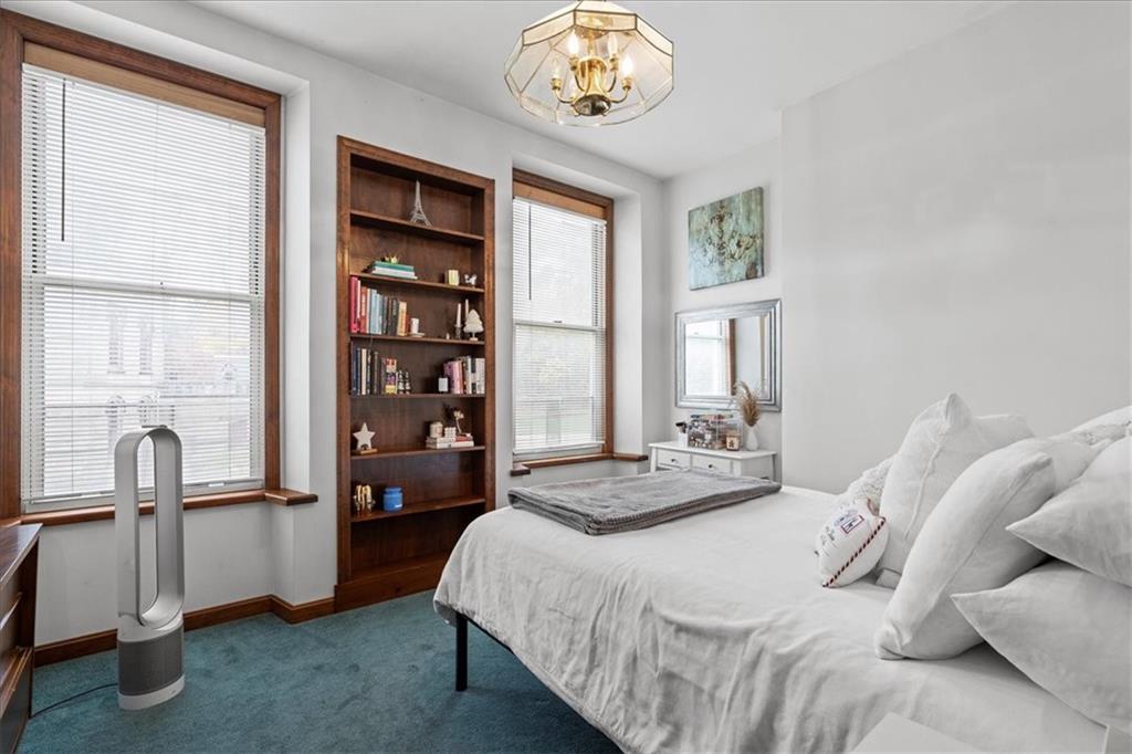 4731 Butler Street Pittsburgh, PA 15201 - Photo 43 of 50 a bedroom with a bed and a window
