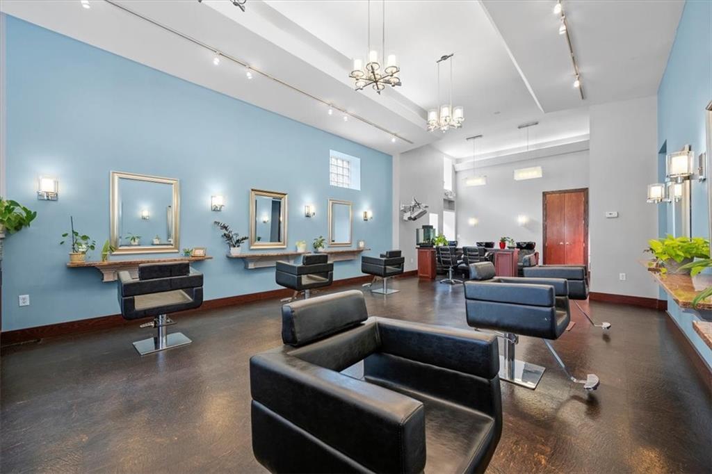 4731 Butler Street Pittsburgh, PA 15201 - Photo 8 of 50 a living room with furniture and a chandelier