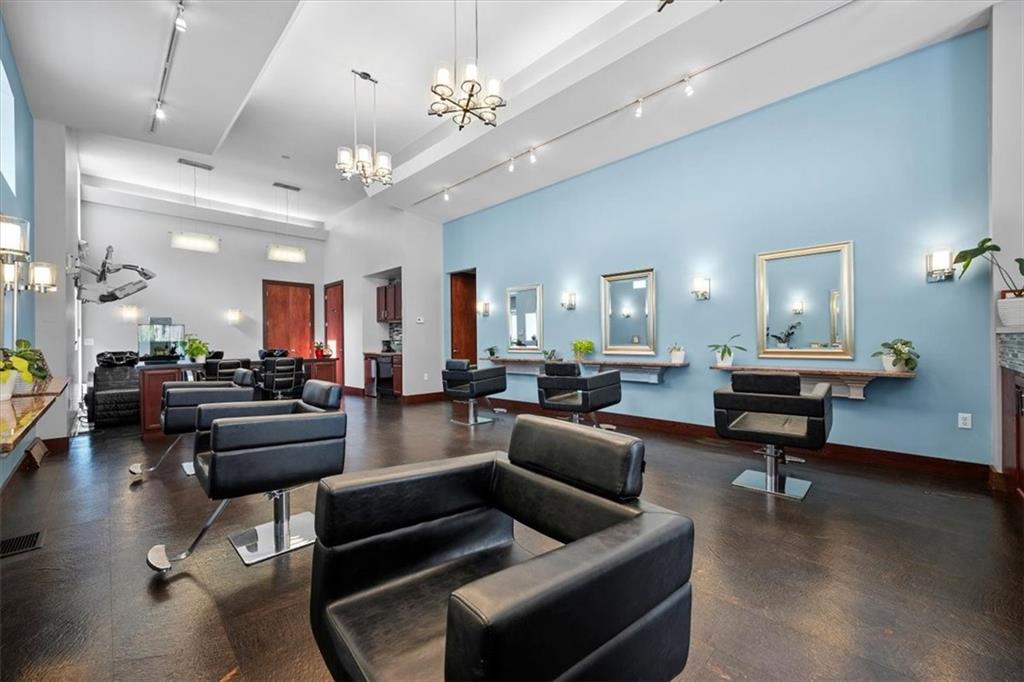 4731 Butler Street Pittsburgh, PA 15201 - Photo 9 of 50 a living room with furniture kitchen view and a chandelier