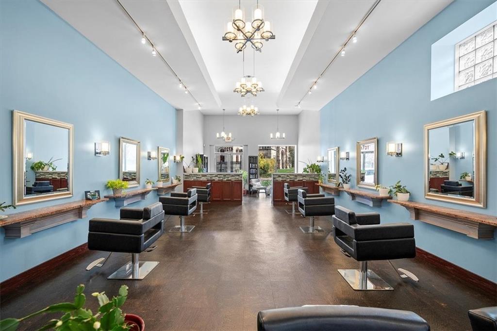 4731 Butler Street Pittsburgh, PA 15201 - Photo 10 of 50 a living room with lots of furniture and a chandelier
