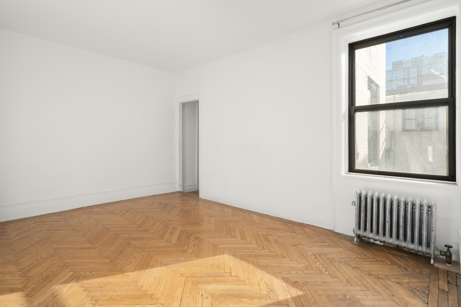 203 West 98th Street, Unit 5D Manhattan, NY 10025 - Photo 2 of 7 an empty room with windows