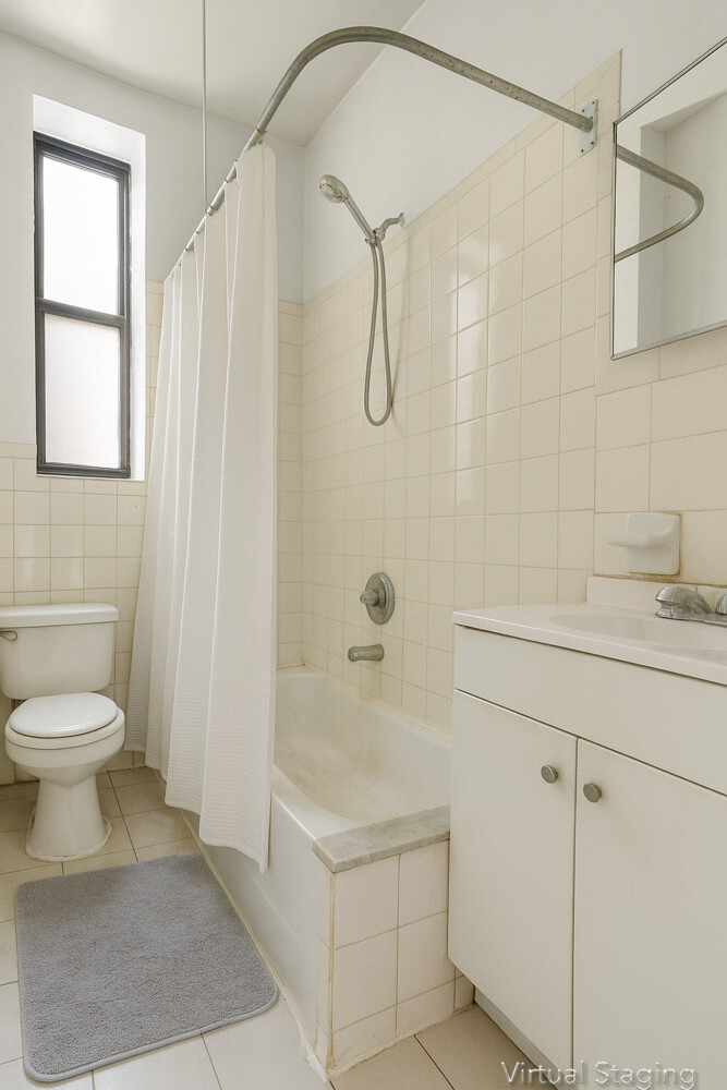 203 West 98th Street, Unit 5D Manhattan, NY 10025 - Photo 6 of 7 a bathroom with a sink a toilet and shower