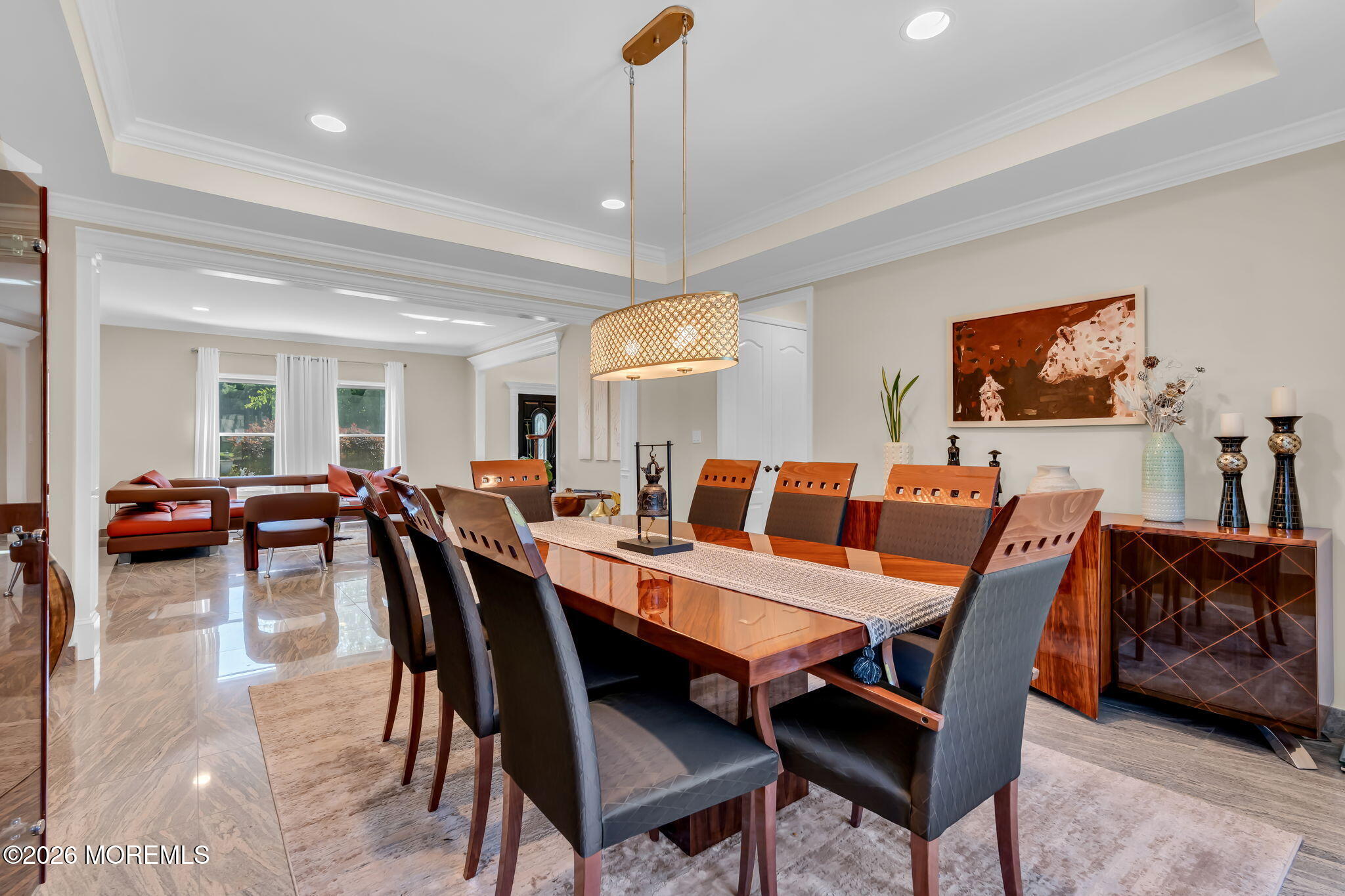 14 Diamond Hill Road Marlboro, NJ 07746 - Photo 15 of 79 a view of a dining room and livingroom with furniture a rug a potted plant and a chandelier