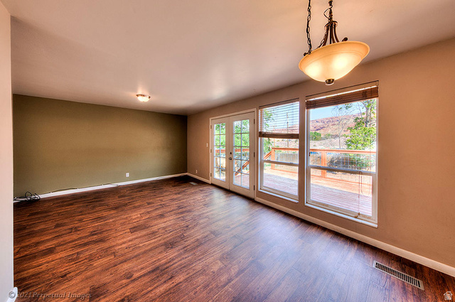 615 East Rose Tree Lane Moab, UT 84532 - Photo 20 of 40 Dining/living area with walkout to upper deck.