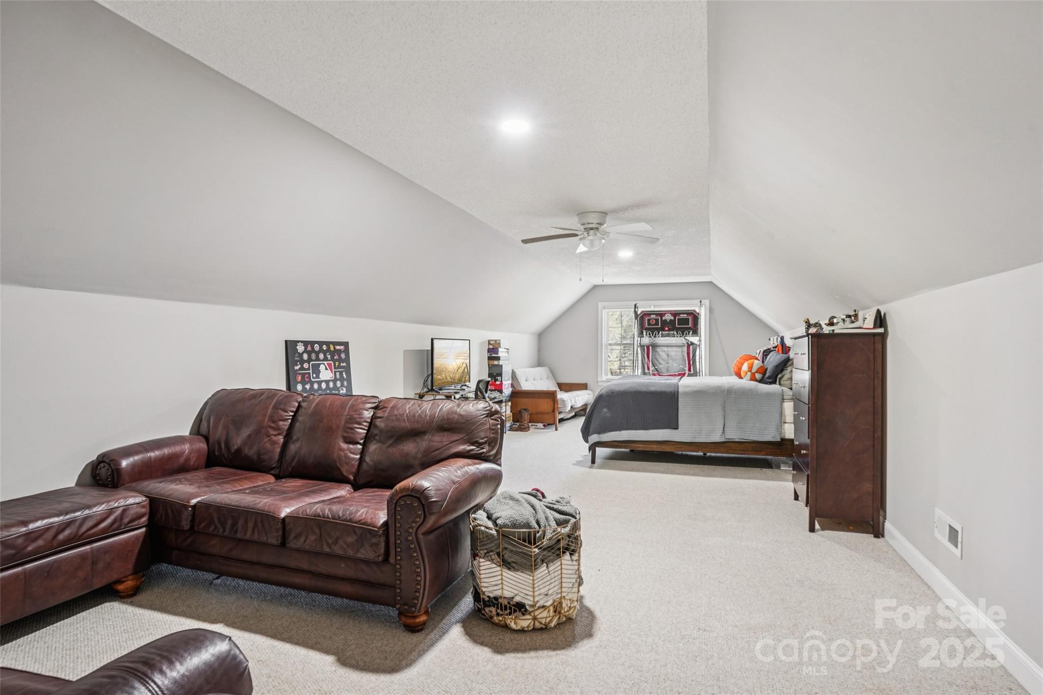 495 Gold Knob Road Salisbury, NC 28146 - Photo 20 of 35 a living room with furniture ceiling fan and a window