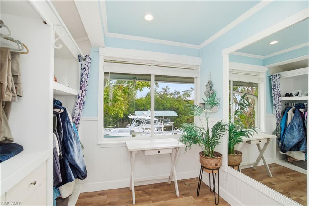 1286 Venetian Way Naples, FL 34110 - Photo 13 of 46 a dining room with furniture and a floor to ceiling window