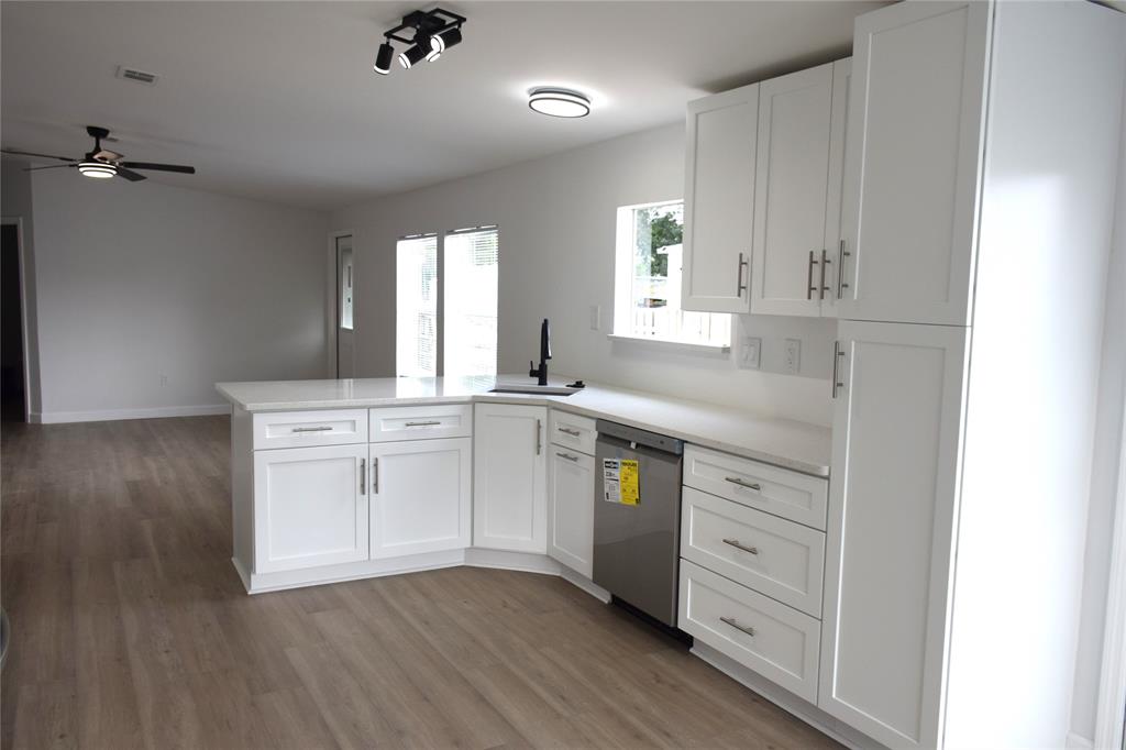 22971 Tradewind Road Boca Raton, FL 33428 - Photo 6 of 13 a kitchen with a sink cabinets and window