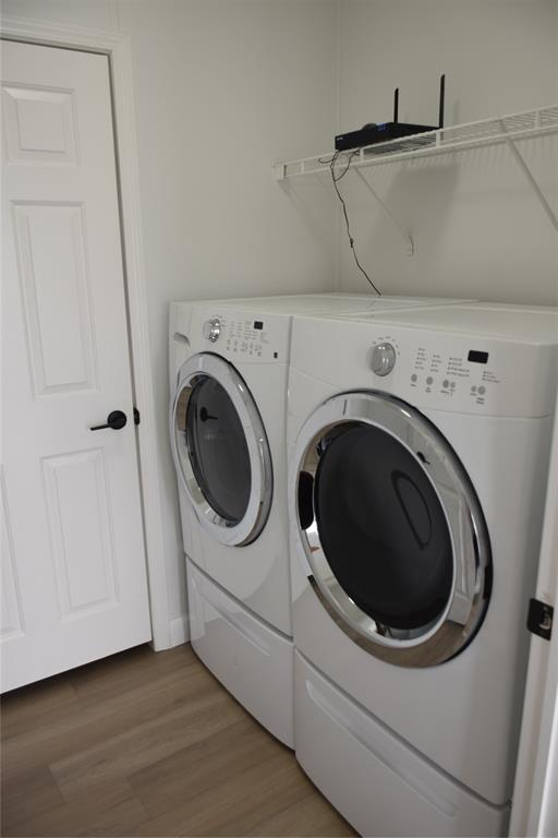 22971 Tradewind Road Boca Raton, FL 33428 - Photo 7 of 13 a utility room with dryer and washer