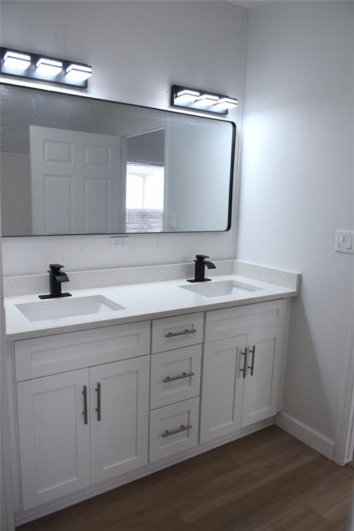 22971 Tradewind Road Boca Raton, FL 33428 - Photo 9 of 13 a bathroom with double vanity sink and a mirror